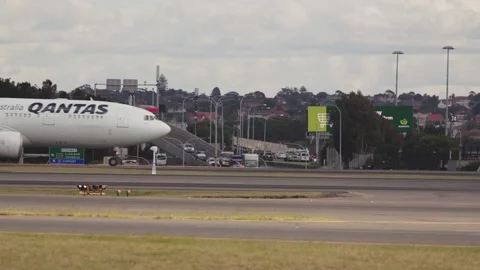 QANTAS WITH ROAD TRAFFIC Stock Footage 162892410