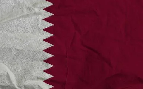 Qatar Flag Textile Closeup - Maroon And White National Flag Fabric With Serrated Stock Photos