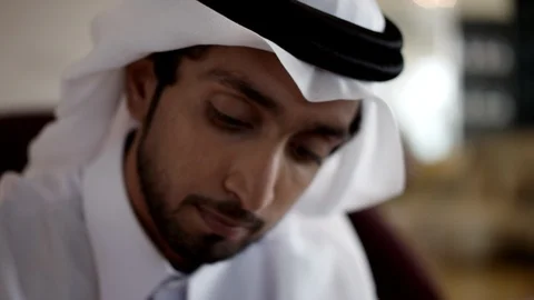 Qatari man drinking beverage. Stock Footage 119392402