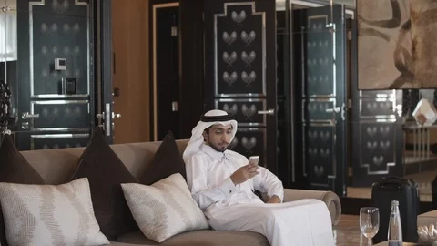 Qatari man messaging on mobile. Stock Footage 119376785