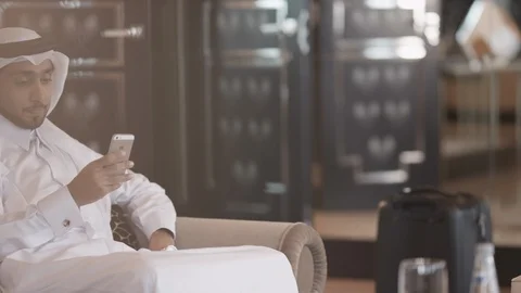 Qatari man messaging on mobile. Stock Footage 119383895