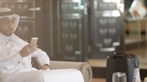 Qatari man messaging on mobile. Stock Footage 119385641