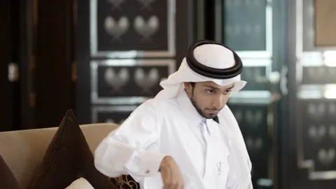 Qatari man messaging on mobile. Stock Footage 119388564