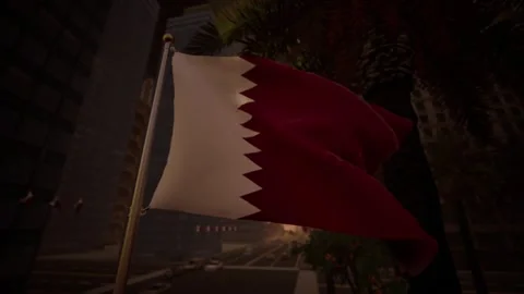 Qatari national flag waving at sunset in a modern city street Stock Footage 322995646