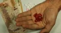 Qatari Riyal QAR, Counting Drugs and Money, Health Care, Colorful Pills HD Footage