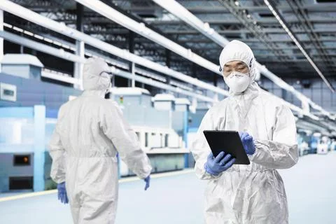 QC engineer inspecting semiconductor production infrastructure Stock Photos