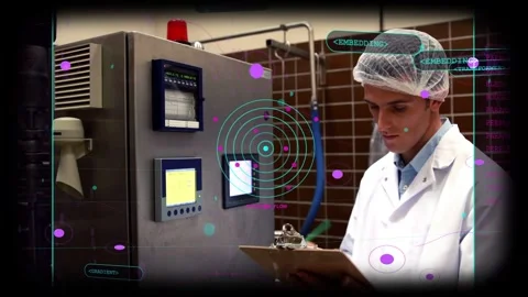 QC tech after scanning displays, tapping screen, HUD marking readings, noting Stock Footage 333287126