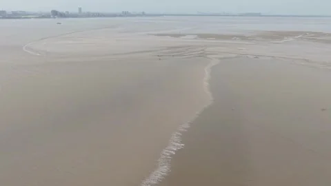 Qiantang River Tidal Bore Sweeping Towards Hangzhou City from Aerial View, China Stock Footage 337349978