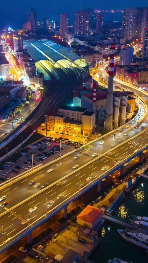 Qingdao City Night Flow: Elevated Highway, Train Station, Marina Timelapse Stock Footage 330882392