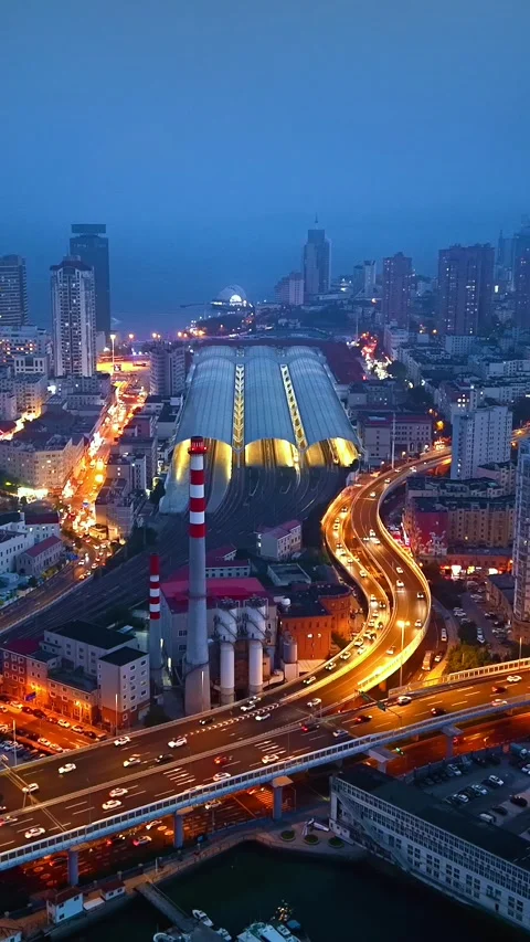 Qingdao Cityscape at Night: Elevated Road &amp; Railway Station Stock Footage 330722254