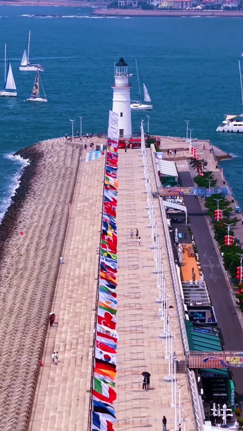 Qingdao Olympic Sailing Center Lighthouse with International Flags Stock Footage 330849033