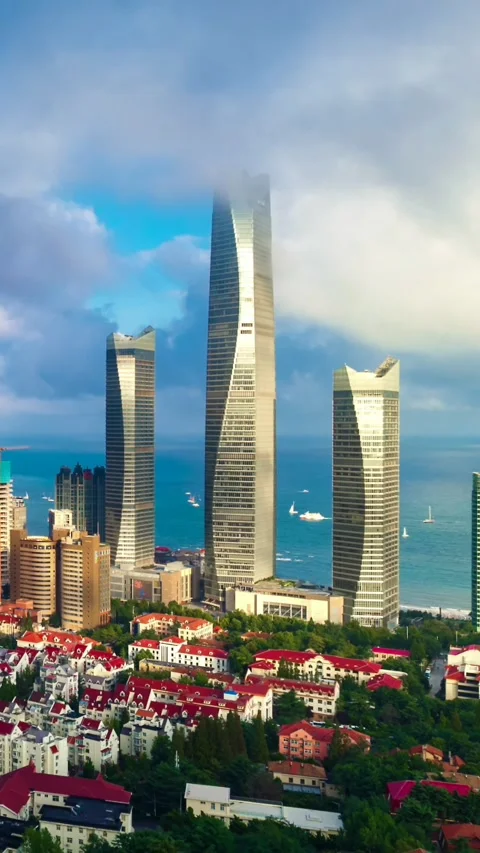 Qingdao Skyscrapers Emerging from Dynamic Clouds Stock Footage 330882507