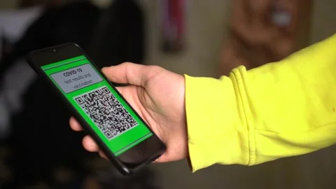 QR code app during Coronavirus pandemic. COVID-19 Test Results on the smartphone Stock Footage 147110849
