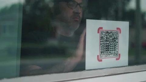QR Code Being Put in The Window as a Sign Stock Footage 156413666