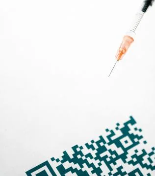 A QR code close up and medical syringe Stock Photos