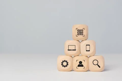 QR code concept with matrix barcode displayed on wooden blocks. Digital mar.. Photos