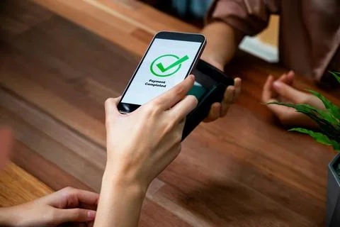 QR code is displayed on screen for cashless payment scanning. Enthusiastic Stock Photos