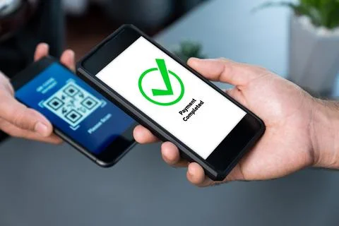 QR code is displayed on screen for cashless payment scanning. Fervent Fotos Stock