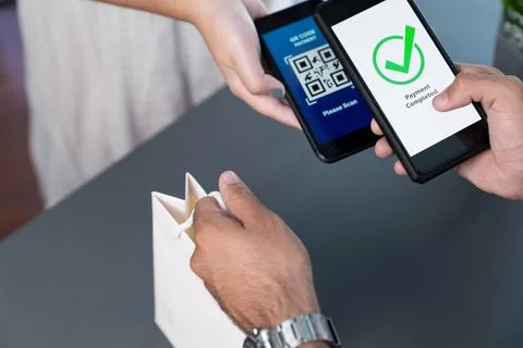 QR code is displayed on screen for cashless payment scanning. Fervent Stock Photos