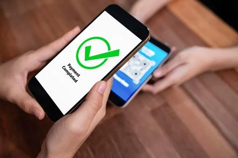 QR code is displayed on screen for cashless payment scanning. Enthusiastic 写真素材