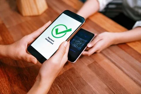 QR code is displayed on screen for cashless payment scanning. Enthusiastic 写真素材