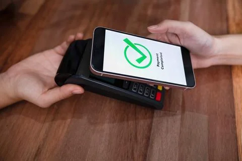 QR code is displayed on screen for cashless payment scanning. Enthusiastic Stock Photos