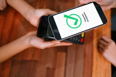 QR code is displayed on screen for cashless payment scanning. Enthusiastic Stock Photos