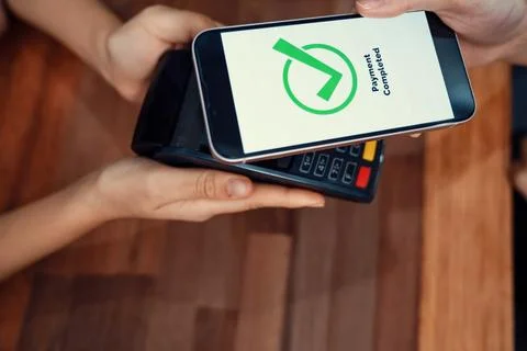QR code is displayed on screen for cashless payment scanning. Enthusiastic Stock Photos