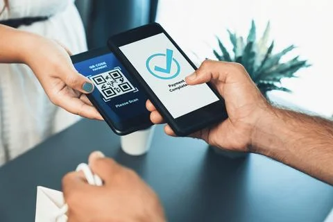 QR code is displayed on screen for cashless payment scanning. Fervent Foto stock