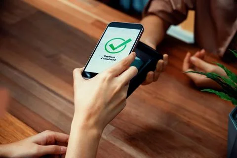 QR code is displayed on screen for cashless payment scanning. Enthusiastic Stock Photos