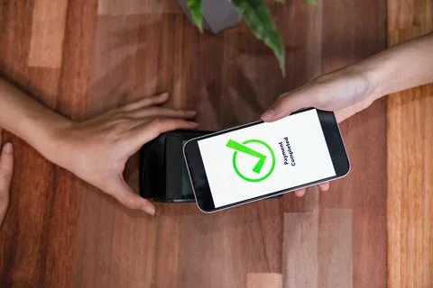 QR code is displayed on screen for cashless payment scanning. Enthusiastic 写真素材