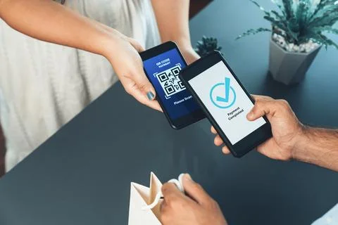 QR code is displayed on screen for cashless payment scanning. Fervent Stock Photos