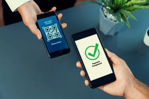 QR code is displayed on screen for cashless payment scanning. Fervent Stock Photos