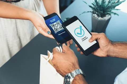 QR code is displayed on screen for cashless payment scanning. Fervent Stock Photos