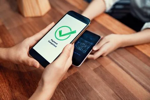 QR code is displayed on screen for cashless payment scanning. Enthusiastic 写真素材