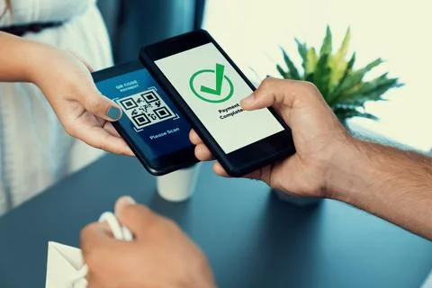 QR code is displayed on screen for cashless payment scanning. Fervent Foto stock