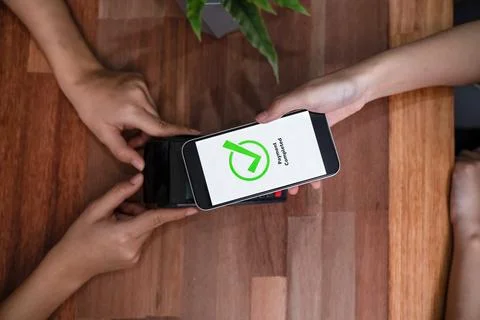 QR code is displayed on screen for cashless payment scanning. Enthusiastic Stock-Fotos