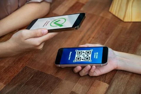 QR code is displayed on screen for cashless payment scanning. Enthusiastic 写真素材