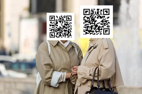 Qr code on the faces of people in the city Stock Photos