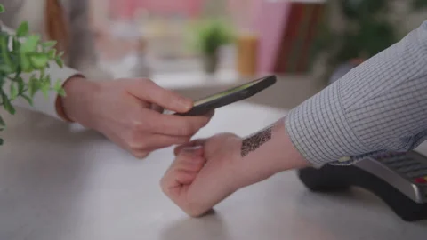 A QR Code on the Inside of a Man's Wrist Getting Scanned by a Smartphone Stock Footage 208797853