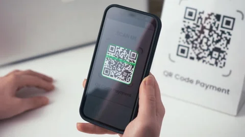 QR code online payment. Using a smartphone app, scan a QR code and pay Stock Footage 258205968