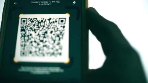 QR code payment made with a modern smartphone and computer screen Foto stock