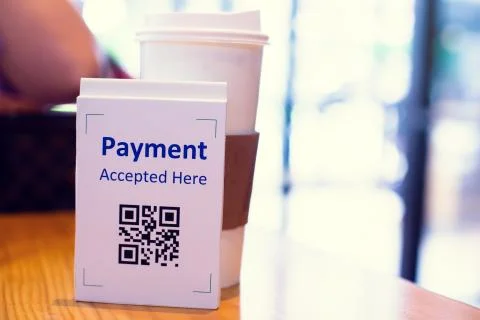 QR code payment tag with blur coffee in coffee shop or restaurant to accepted Stock Photos