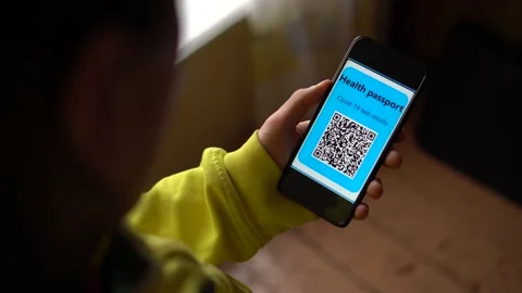QR code with personal encrypted data on the smartphone screen. Health passport Stock Footage 147110854