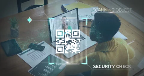QR code scanning animation over person working at desk with laptop Stock Footage 306243565