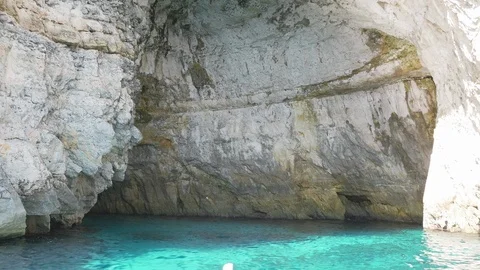 Qredi, Malta, sailing inside the blue grotto cave Stock Footage 117603583