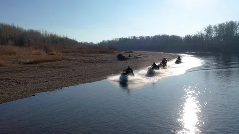 Quad bikes go to the Ford on the river 库存影片 126636818