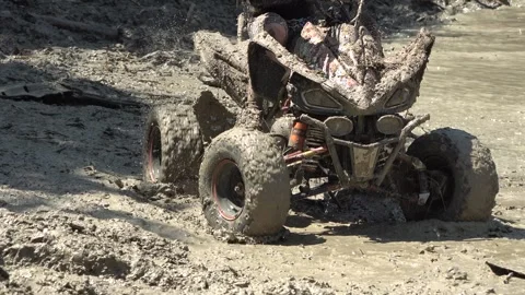 Quad biking on muddy terrain Stock-Footage 333457039