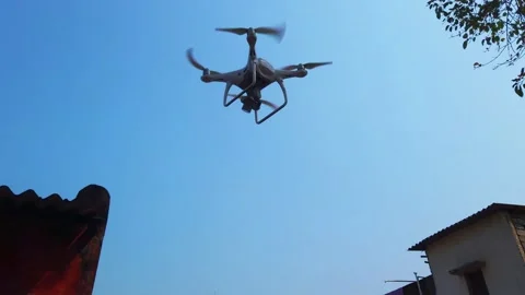 Quad copter drone flying and landing in hand Stock Footage 172292836