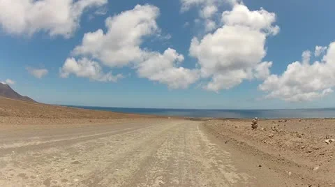 Quad Driving Across The Desert Front View 1 Video stock 11017600